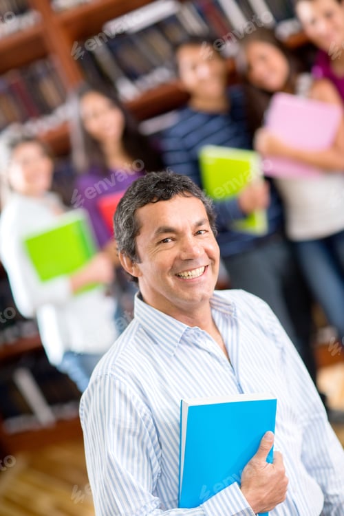 Preview: Friendly Male Teacher With A Group Of Students Smiling