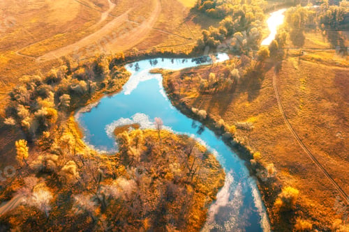 Preview: Aerial view of curving river at sunrise in autumn. View from air