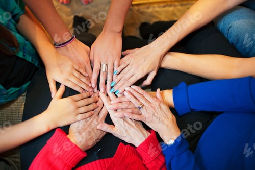 Preview: Multigenerational females touching hands