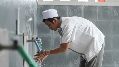 Preview: A portrait of an asian muslim ablution at mosque before pray