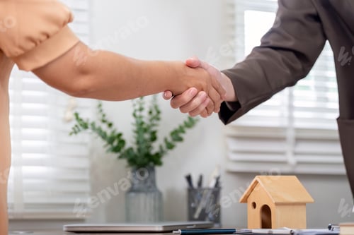 Preview: Successful Property Deal Handshake Between Agent and Client