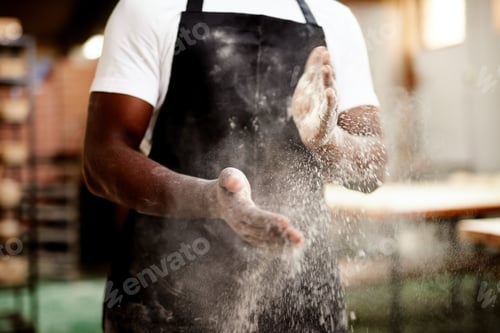 Preview: Done and dusted. Cropped shot of an unrecognizable male baker dusting the flour off his hands.