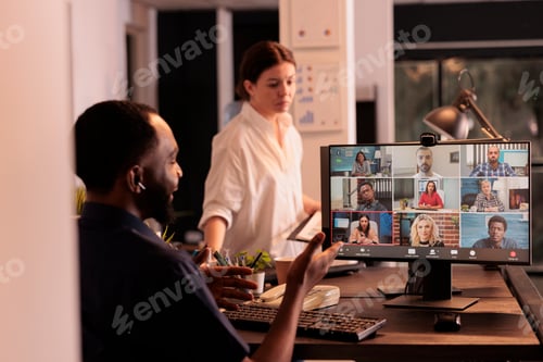Preview: African american employee talking on videocall using teleconference software
