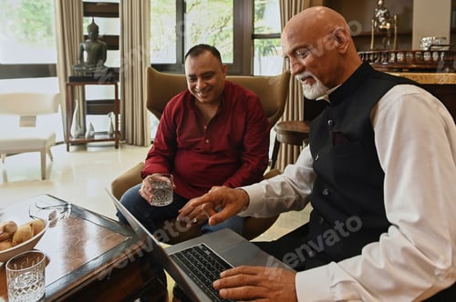 Preview: Friends Using Laptop At Meeting