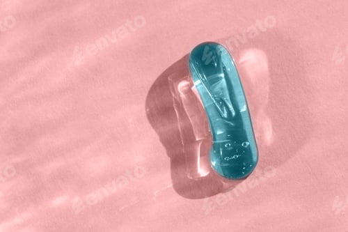 Preview: Cosmetic cream texture, jelly blob. Blue transparent gel smear smudge swatch on pink backdrop