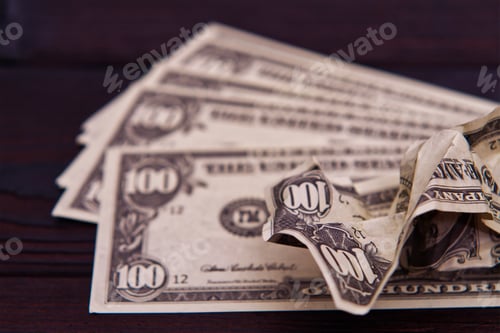 Preview: Pile of Hundred Dollar Bills on Dark Background