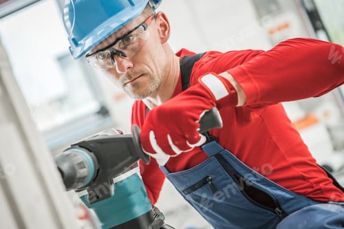 Preview: Contractor Worker Drilling Another Hole For an Electric Outlet Point