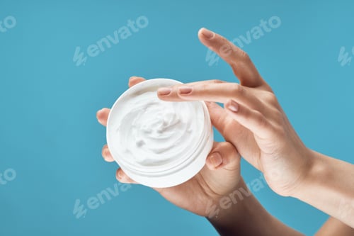 Preview: female hand white jar with cream skin care health dermatology