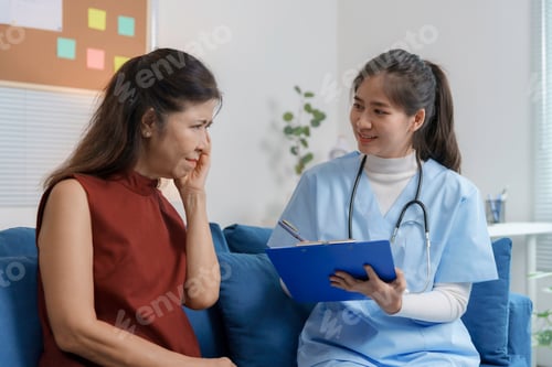 Preview: Woman Consoling Friend at Home Medical Visit