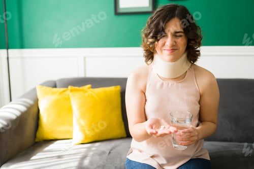 Preview: Pained woman taking pills after an accident