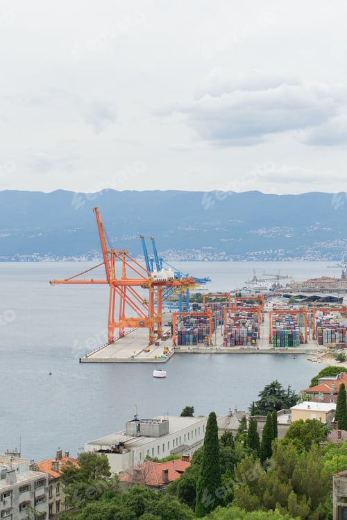 Preview: Huge factory situated on the sea surrounded by mountains