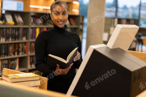 Preview: Librarian Utilizes Self-Service Library Terminal