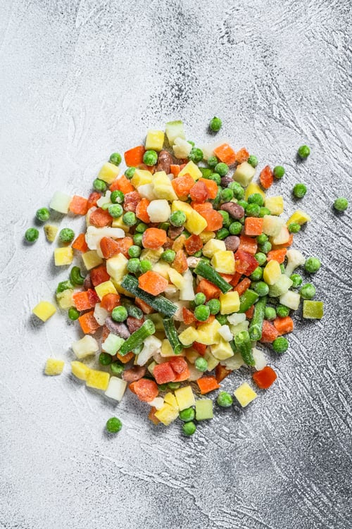 Preview: Frozen vegetables. broccoli, cherry tomatoes, corn, pea, carrot. White background. Top view