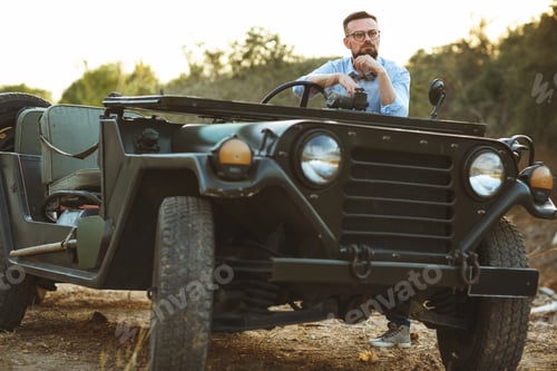 Preview: Young stylish man with glasses and bow tie near the old-fashione
