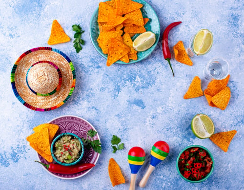 Preview: Traditional Mexican food nachos, salsa, guacamole, tequila.