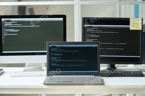 Preview: Workplace of programmer with computers with codes