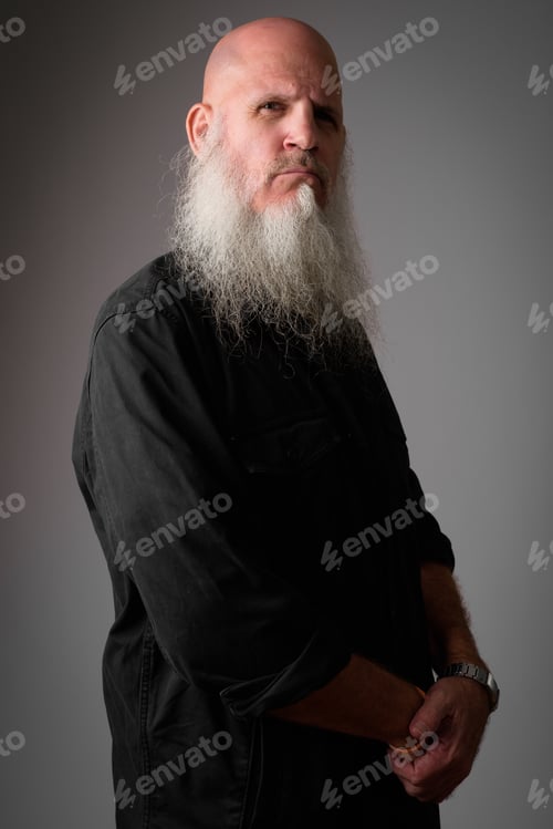 Preview: Profile view of mature bald man with long beard