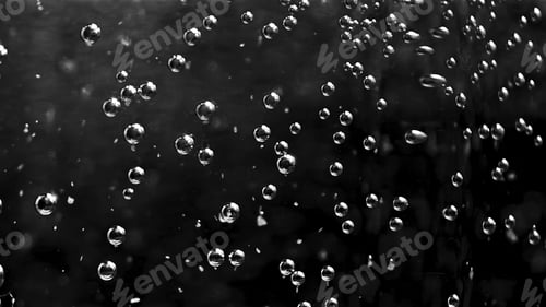 Preview: Abstract air bubbles moving underwater. Stock footage. Close up of round transparent oxygen bubbles