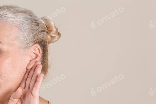 Preview: Mature woman with hearing problem on light background, closeup. Space for text