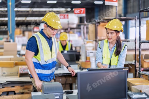 Preview: Staff working in large depot storage warehouse trainee check packing box and scan at cashier counter