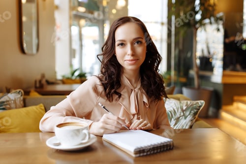 Preview: Portrait of a business woman in a cafe.