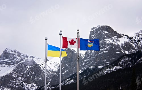 Preview: Canada, Alberta and Ukraine flags fly proudly in the Rocky Mountains in support of peace in Ukraine.