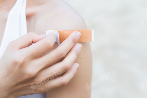 Preview: woman arm with an adhesive bandage