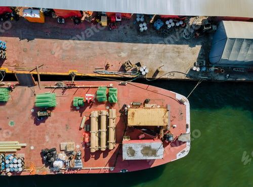 Preview: Barge the on a construction vessel in the building pipes and metal structures cargo