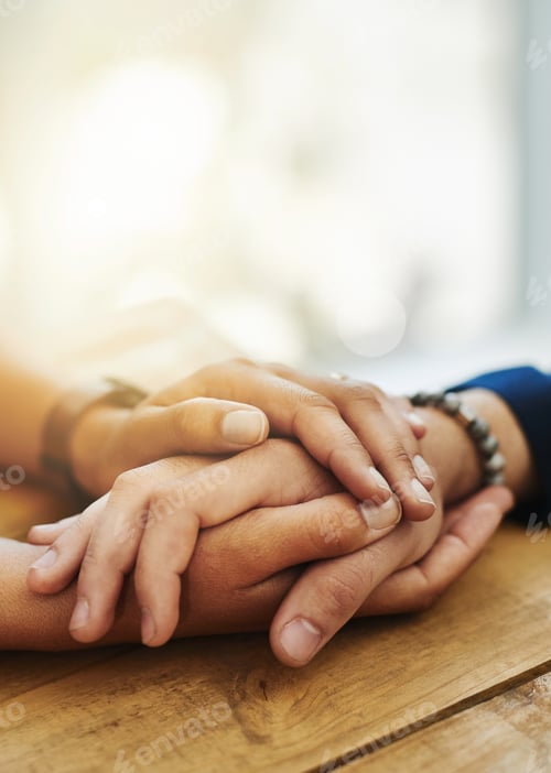 Preview: Closeup shot of two unrecognizable people holding hands in comfort