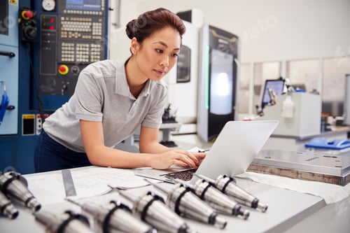 Preview: Female Engineer Using CAD Programming Software On Laptop