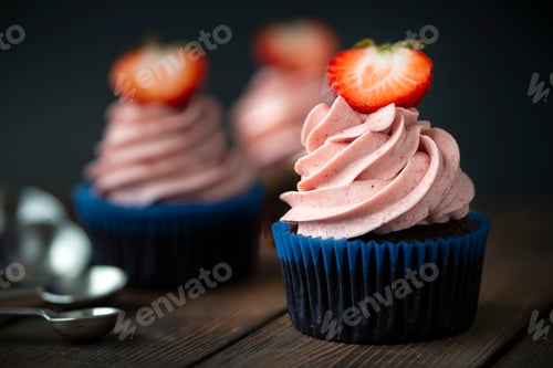 Preview: Delicious Strawberry Cupcakes with Pink Frosting on Wood