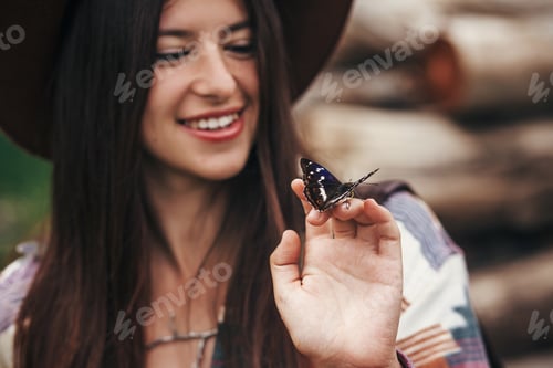 Preview: Beautiful butterfly on girl hand