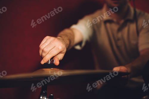 Preview: Close-up: Drummer arranging cymbals for a recording session