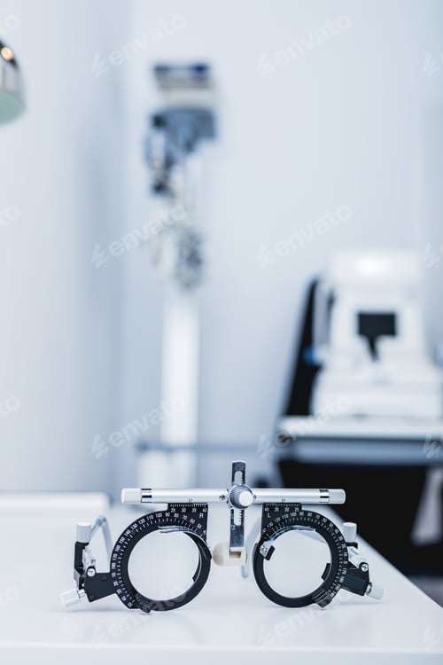 Preview: Eye testing glasses in optician's office.