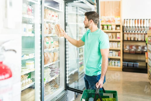 Preview: Young Man Buying Food In Supermarket
