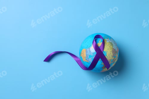 Preview: Globes with purple ribbon cancer awareness on blue background.