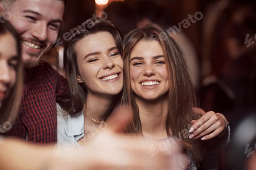 Preview: Feeling happy. Beautiful youth have party together in the nightclub