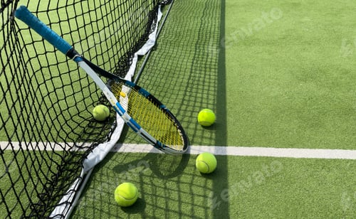 Preview: A tennis racket and new tennis ball on a freshly painted tennis court