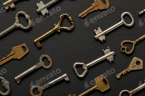 Preview: top view of vintage rusty keys on violet background