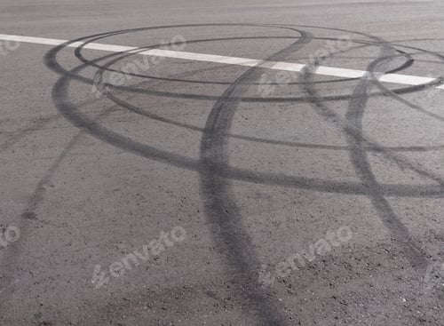 Preview: Black trail from rubber tires on the asphalt