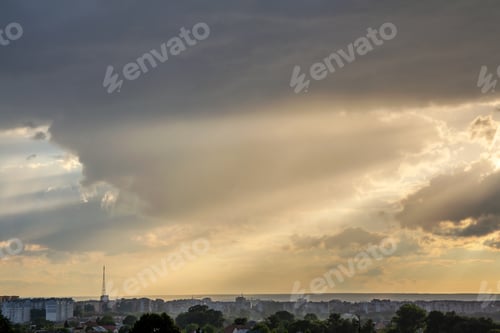 Preview: Sunset sky covered with dramatic storm puffy clouds before rain