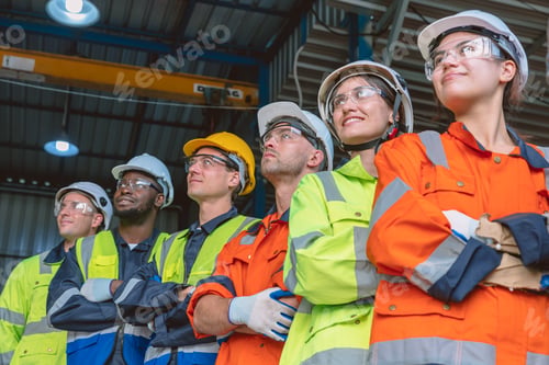 Preview: people group of engineer technician and service team worker in safety suit standing together happy
