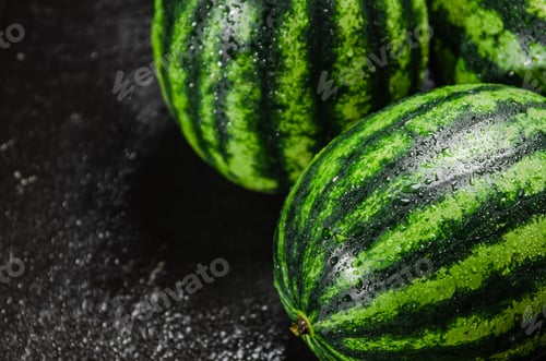 Preview: Fresh watermelons on table .