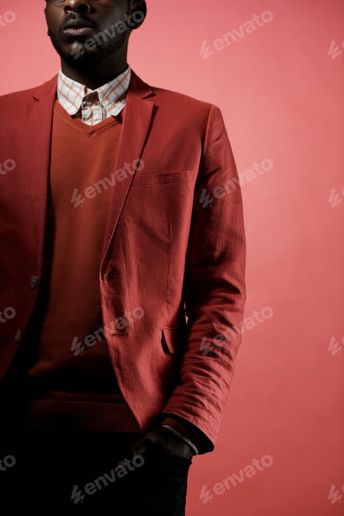 Preview: Black Man in Fashionable Red Outfit Posing in Studio