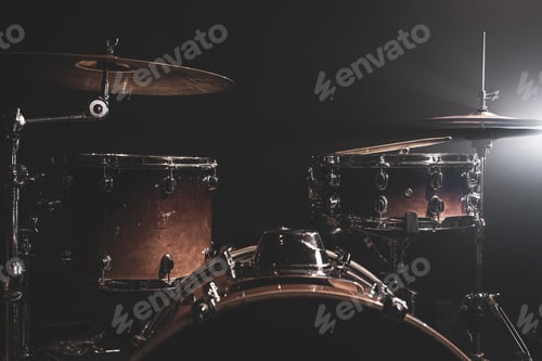 Preview: Drum kit in the dark with stage lighting, copy space.