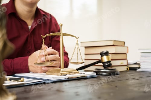 Preview: A male lawyer is working at his desk on online judicial review,focusing on justice,fairness,legal