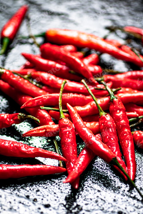 Preview: Pods of hot chili peppers on the table.
