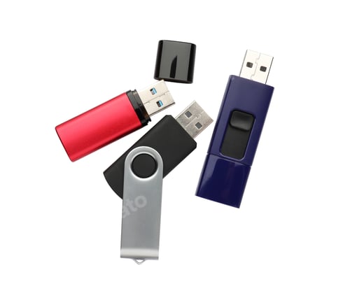 Preview: Modern usb flash drives on white background, top view