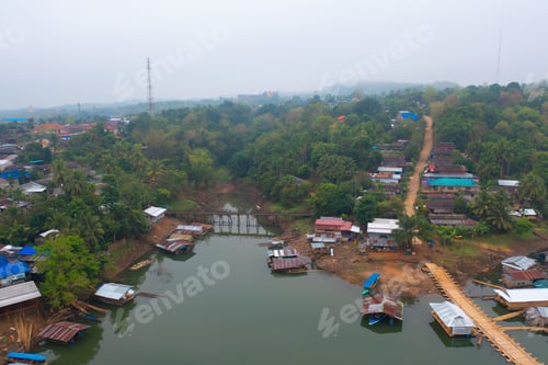 Preview: Aerial top view of houses in Mon village, Kanchanaburi, Thailand in urban city town in Asia