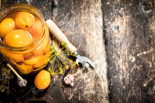 Preview: Pickled tomatoes with herbs and spices in jar.